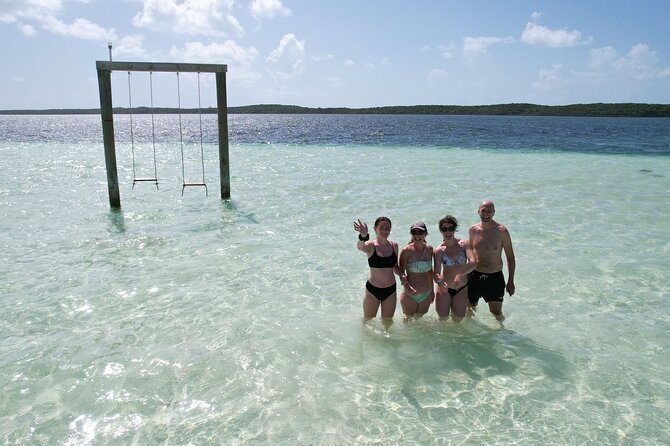 Pink Sand Beach and Swimming Pigs Adventure from Nassau - The sandbar swings near Spanish Wells